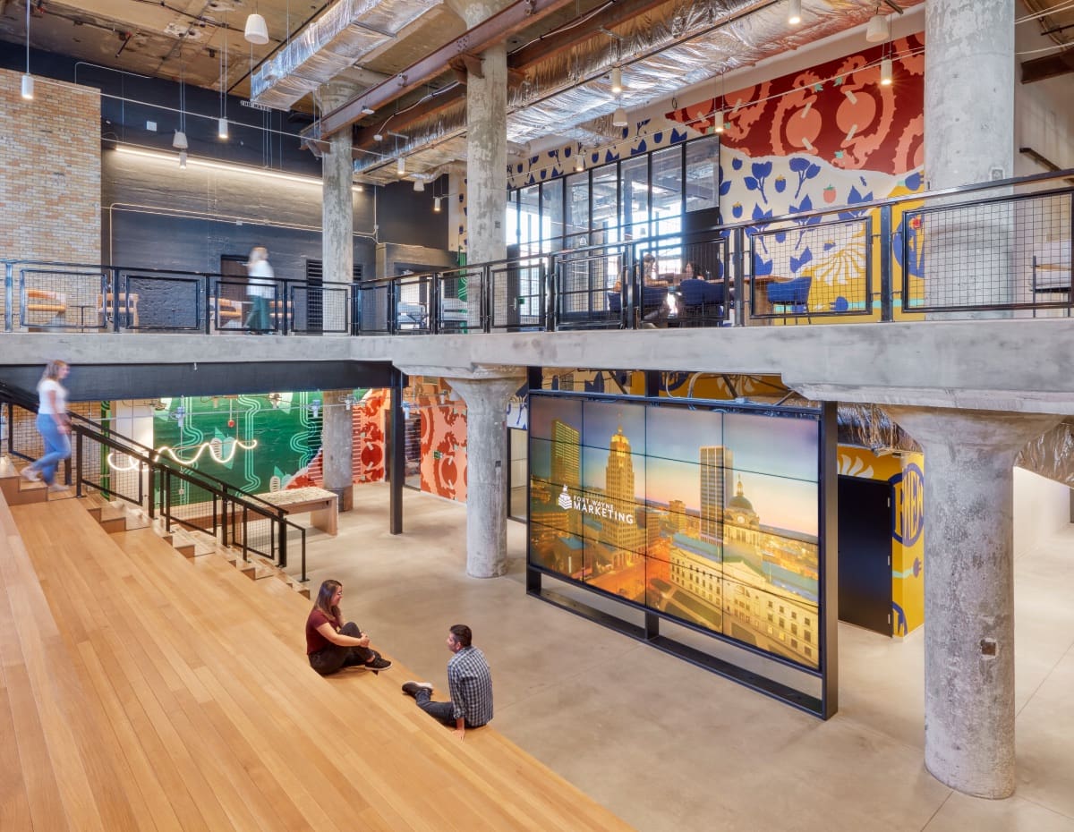 Industrial-style office with communal stairs