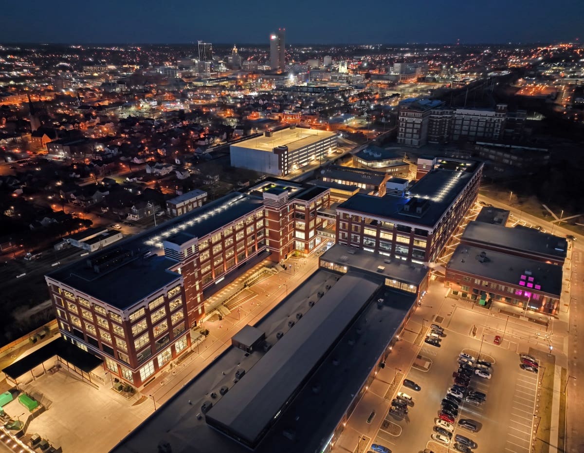 Cityscape at night with illuminated buildings